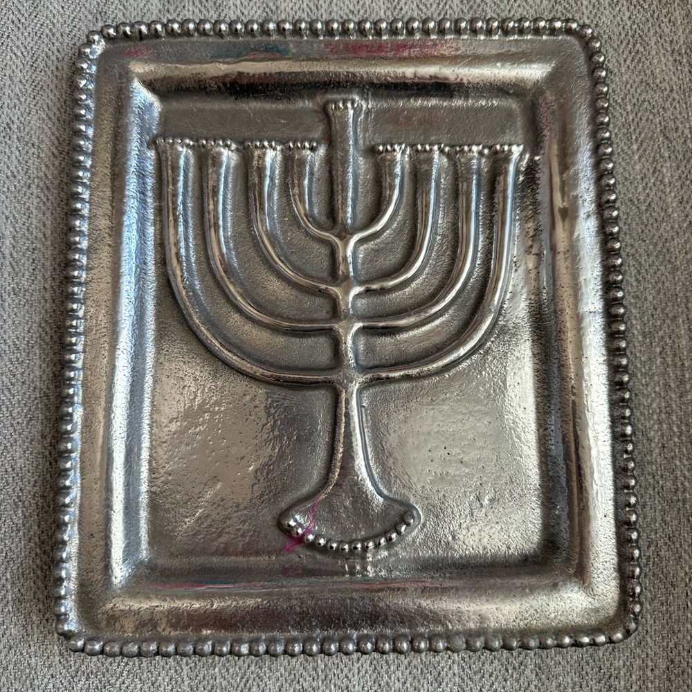 Brand new, made in India.  Decorative menorah plate.  I think it is metal.